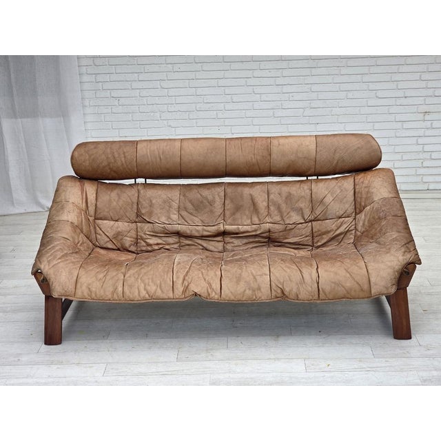 1970s, Norwegian design by Jan Erik Lindgren. 2-seater sofa model "Amazon". Original light brown furniture leather, teak...