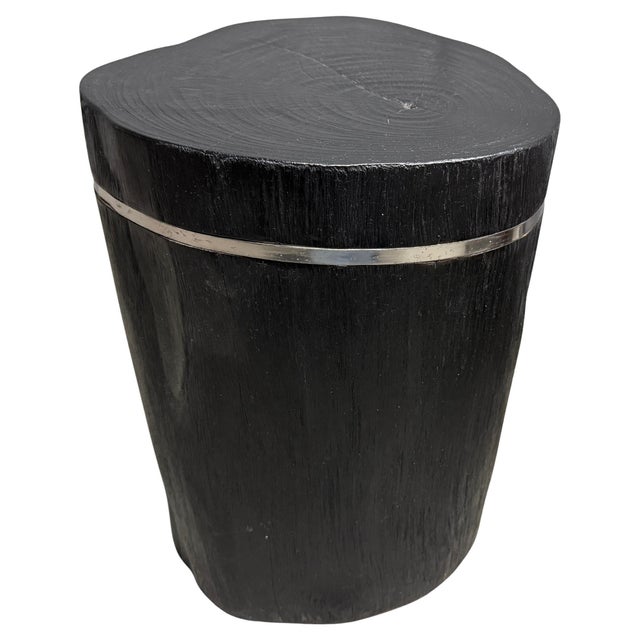 Minimalist reclaimed teak wood side table with a thin silver stainless steel inlay. Charred, sanded and sealed revealing...