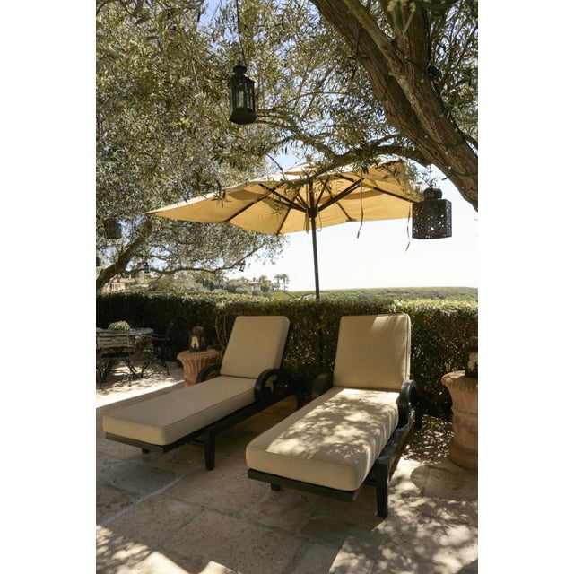 A Pair of Ebonized Teak Adjustable Chaises Lounge, Probably Giati Designs from the below estate. See photos of the chairs...