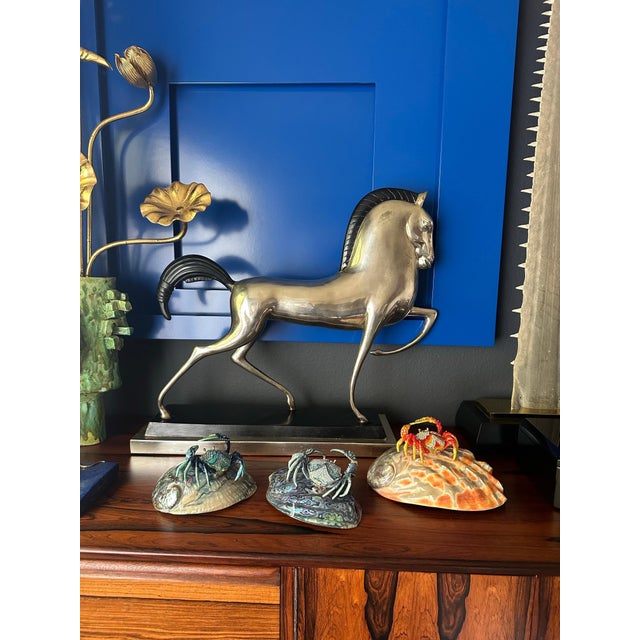 Jeweled enameled metal crab sculpture with secret compartment on a polished abalone shell in the style of Jay Strongwater.