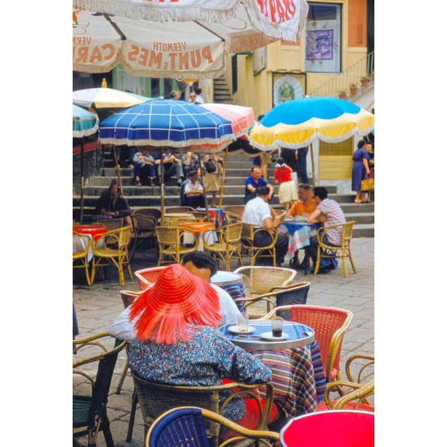 Capri Café by Toni Frissell A lady in a red hat sits at an alfresco café in Capri, 1959. (Photo by Toni Frissell) 16x12"...