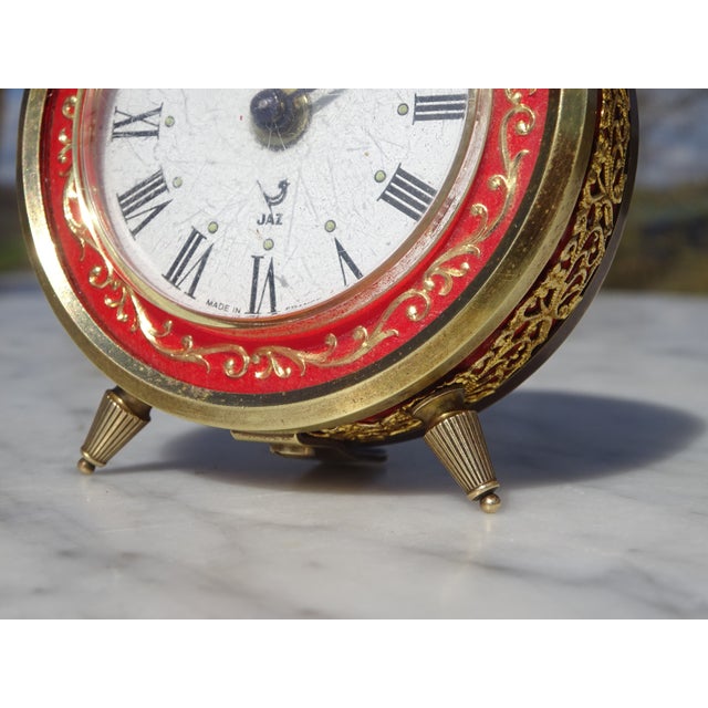 Vintage hand-wound alarm clock with a bail and alarm. Made in France between 1968 and 1970. White dial with Roman numerals...