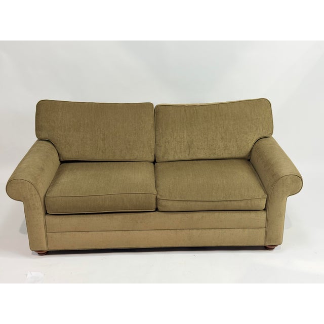 This is a classic two-seater sofa by Ethan Allen, designed with a timeless silhouette that balances comfort and structure....