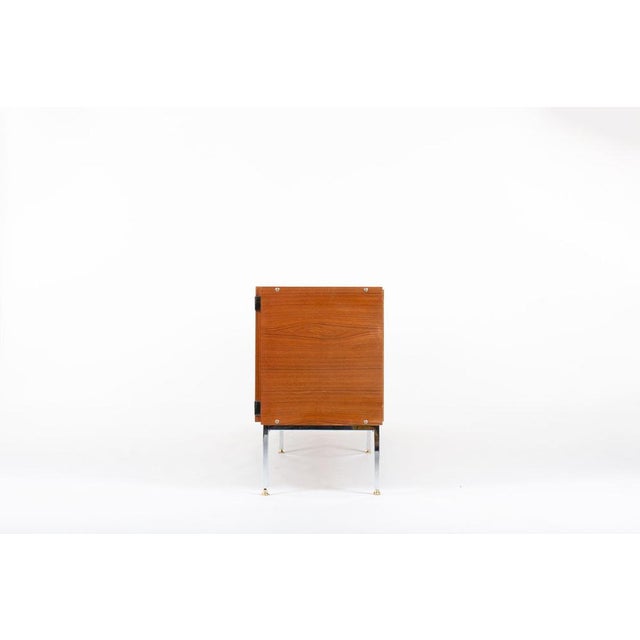 Designed in the 1960s by Luigi Bartolini, this impressive Italian sideboard exemplifies the sleek, modern aesthetic of the...