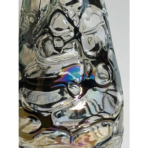 This Italian sculptural art glass vase in clear and iridescent black glass, attributed to Angelo Rinaldi and dating to the...
