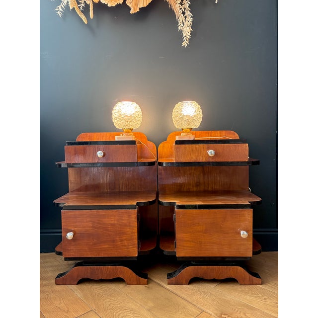 Pair of lamps, each with a pink alabaster base with a push button and a cut glass globe. 1960s. In excellent condition....