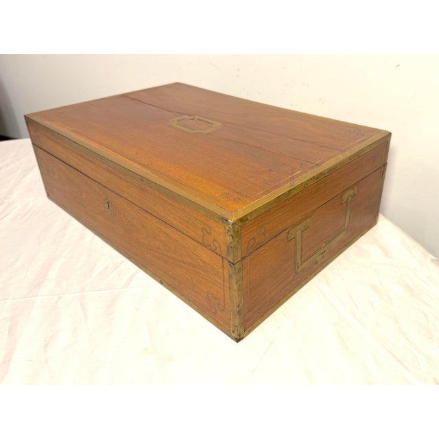 This antique 19th century brass inlaid wooden writing lap desk box is a very high quality handmade piece. Crafted with...