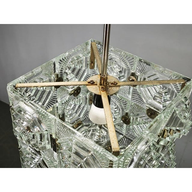 Sculptural Brutalist glass cube pendant light from Kamenický Šenov, Czechoslovakia, dating to the 1970s. The fixture is...