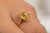 This is part of Chairish’s Fine Jewelry assortment. This 18K solid yellow gold ring features a natural yellow sapphire,...