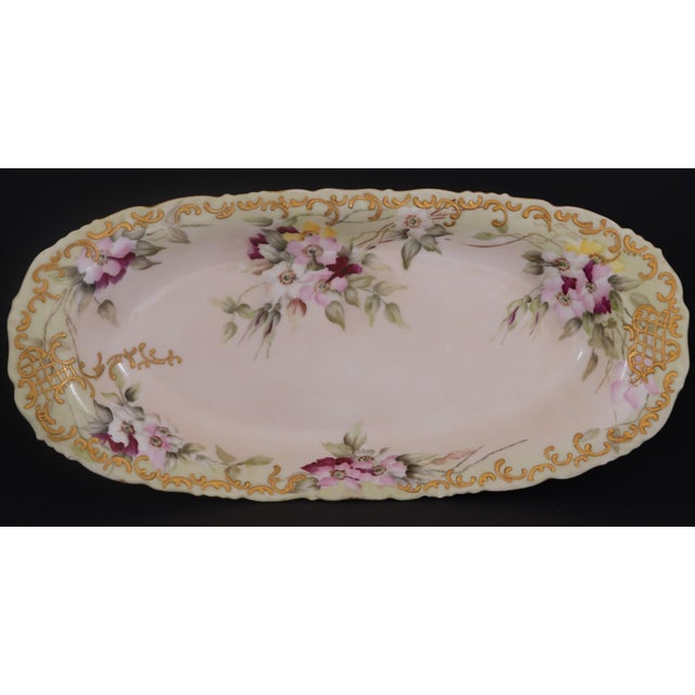 Elegant antique Haviland Limoges porcelain relish tray featuring a soft blush ground with finely hand-painted floral...