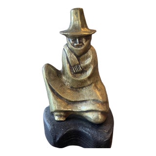 1970s Brass Sculpture of Seated Man All Bundled Up For Sale