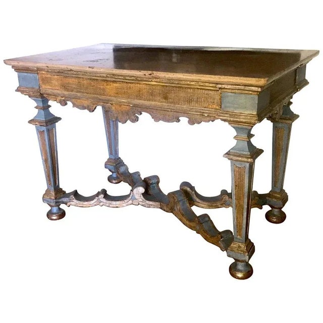 Elegant Italian 17th century light blue painted and parcel-gilt console tables with a marble top. Provenience from a...