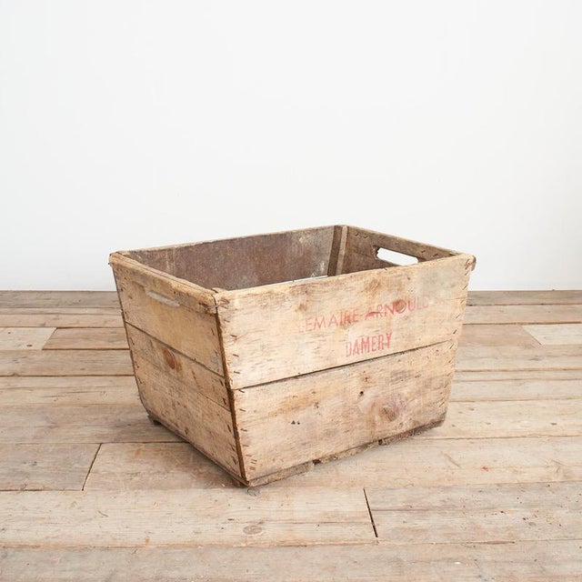 A grape collection wooden crate from a French vineyard in the Champagne region of France. The trug is stamped with the...