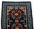 Tibetan Gyantse Wool Khaden Rug, with stylized floral motifs on a blue ground. 4' 4.5" L x 2' 3.5" W. Provenance: From the...