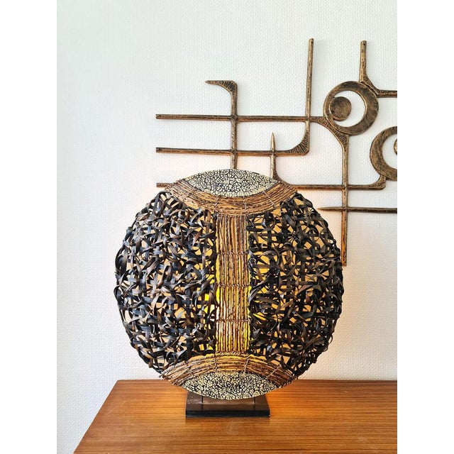 Absolutely one of a kind, this beautiful rattan table lamp. Period: 1980. Beautifully woven rattan rope & warm neutral...