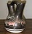 A striking 1987 hand‑painted wedding vase from Hozoni Pottery, decorated by Native American studio artists and signed...
