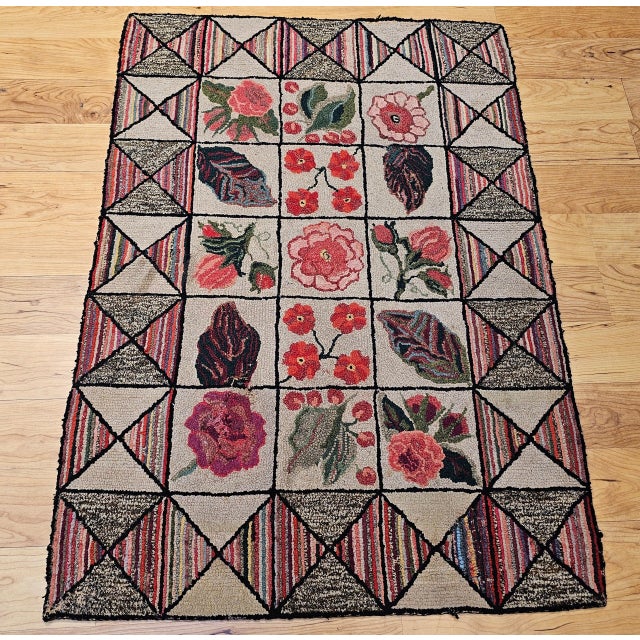 29” x 42” Vintage American hand hooked area rug in a block pattern circa the early 20th century. The very unique and...