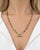 A sophisticated 18K yellow gold necklace by Roberto Coin, featuring an elegant series of elongated oval links interwoven...