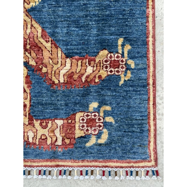 Afghan Tibetan tiger design rug. Hand-knotted in Afghanistan in hand-spun lambswool, after the tiger pelt rugs of Tibet....