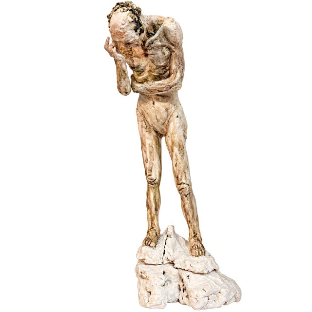 A striking set of three hand-sculpted figurative works depicting male figures in deeply expressive, contemplative poses....