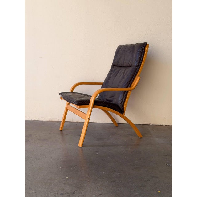 Authentic vintage Danish lounge chair produced by Stouby in Denmark during the 1960s. This piece showcases the refined...