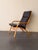 Authentic vintage Danish lounge chair produced by Stouby in Denmark during the 1960s. This piece showcases the refined...