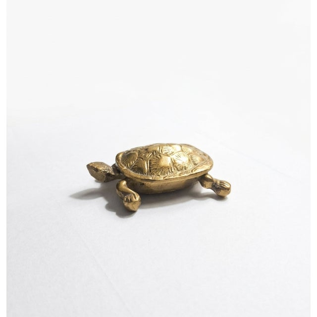 Bring a touch of classic Palm Beach charm to your tabletop with this delightful vintage solid brass turtle trinket box....