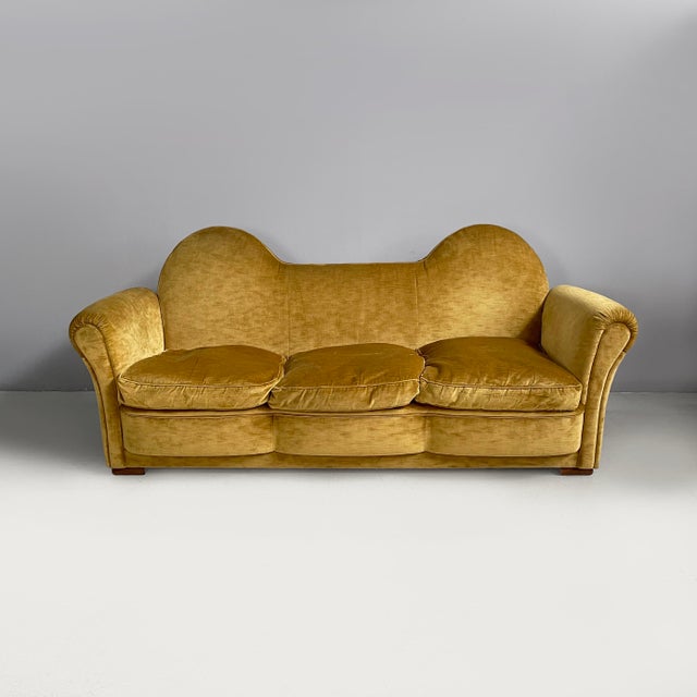 Italian mid-century modern yellow velvet sofa by Tito Agnoli for Poltrona Frau, 1950s Three-seater sofa padded and...