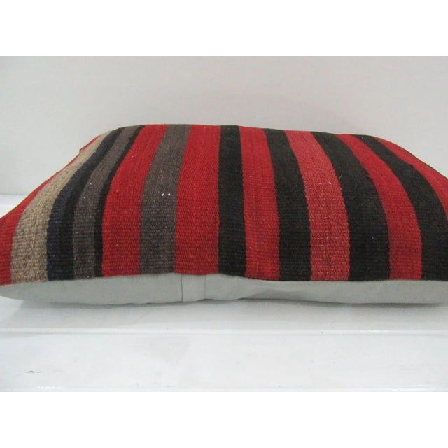 This is a pillow cover made from a vintage kilim rug. The piece was properly washed and ready to use. Pillow inserts not...