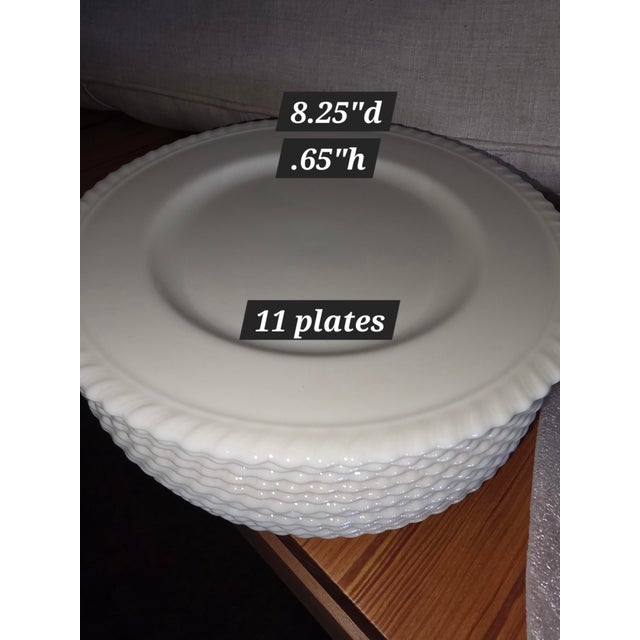 Set of 11 Lenox plates in the Gadroon Pattern.