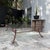 20th century bronze and beveled glass table in the style of Giacometti. Suitable for outdoor use.