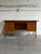 This vintage freestanding office workstation features an expansive rectangular top paired with dual drawer pedestals for...