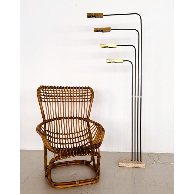 Elegant and sculptural Mid-century floor lamp manufactured by Goffredo Reggiani, Italy, in the 1960s. Featuring four...