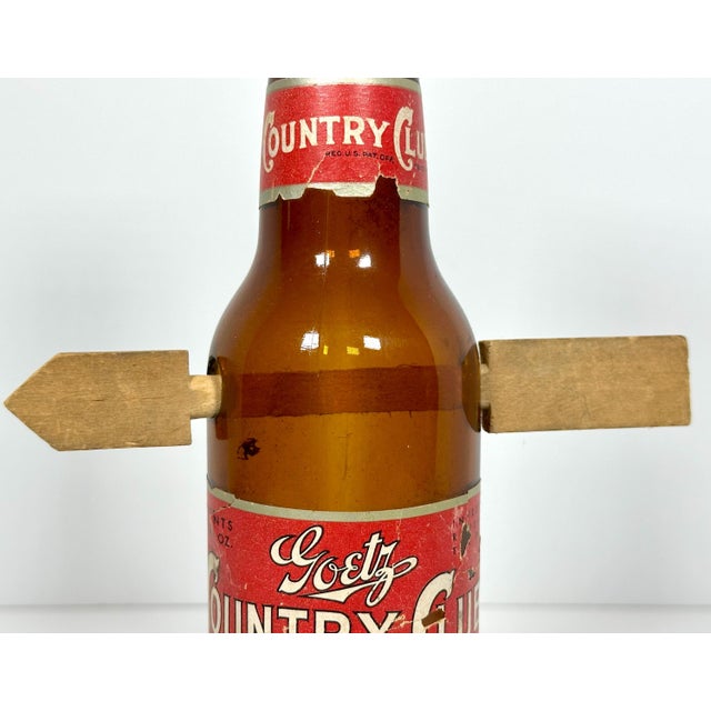 Folk Art Arrow Through Goetz Beer Bottle for your consideration. The bottle measures approx. 10 inches tall. Base diameter...
