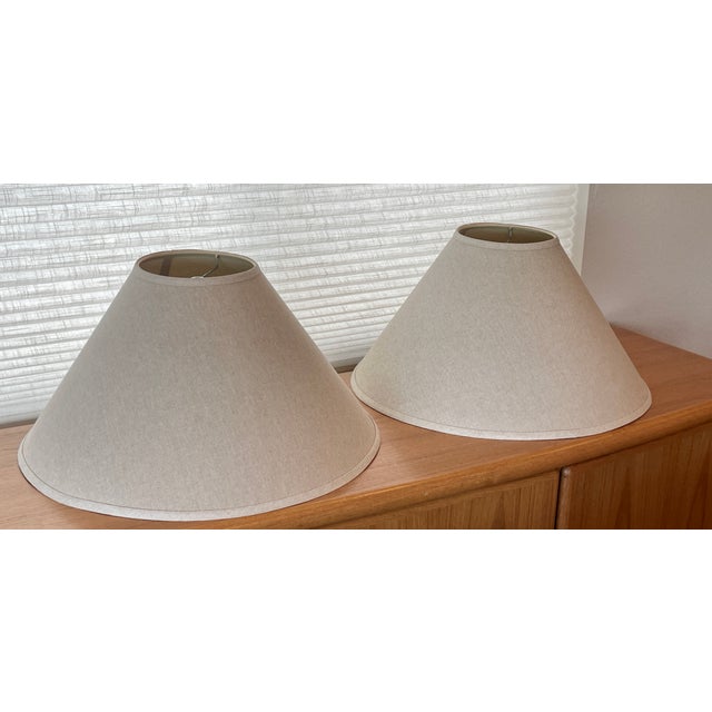 Rare find. Two good sized, postmodern, matching cone lamps in near mint condition. Shades measure approximately 12" tall...