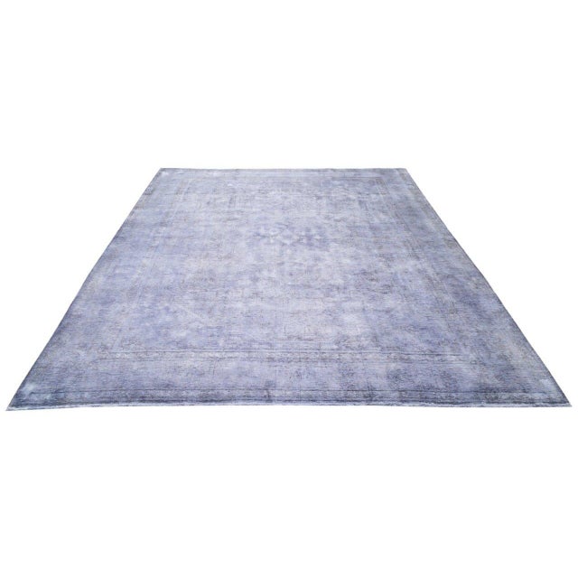 Hand-knotted with care using traditional rug-making techniques, this wool rug blends timeless craftsmanship with a modern...