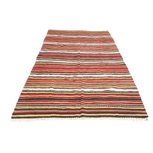Handwoven vintage striped kilim rug from Denizli region of Turkey. Approximatelly 45-55 years old. In very good condition.