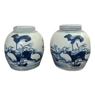 Pair of Mid 20th Century Blue and White Ginger Jars With Coastal Depictions of Cranes, Water and Shore Grass For Sale