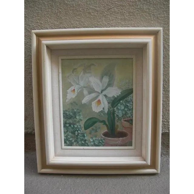 Perfectly displayed in a gold-accented, pale yellow wood frame, this white iris floral still life is the perfect accent to...