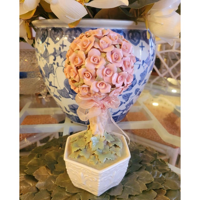 A beautiful porcelain ceramic rose topiary music box. The piece plays La Vie En Rose, in such a pretty rose topiary with a...