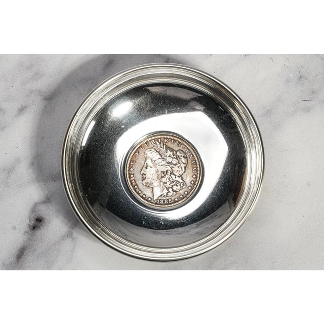 A handsome combination of Cartier craftsmanship and American numismatic history, this circa 1940s sterling silver catchall...