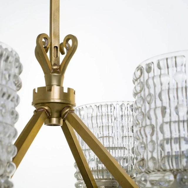 Pressed glass and brass German chandelier. Rewired to the US. Origin: Germany Circa: 1960s Dimensions: 19.50" high ,...