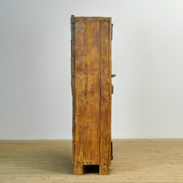 Primitive cabinet from Transylvania, circa 1900, made of solid sawn or carved beechwood. This authentic folk cabinet...