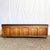 beautifully preserved Mid-Century Modern cedar chest, featuring a warm walnut exterior with sculpted paneling and a tufted...