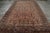 Hand-knotted in wool, this 12x21 antique Persian Sarouk rug originating circa 1920-1930, with intricate floral patterns,...