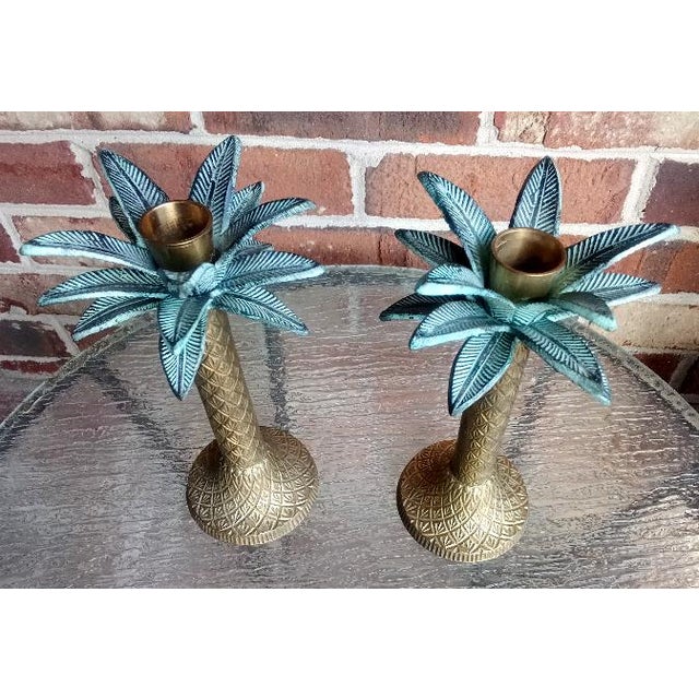 Made in India of brass during the 1970’s, this pair of charming candlesticks have dazzling diamond designs on their trunks...