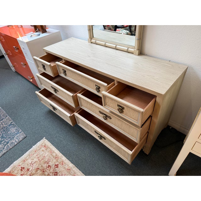 Design Plus Gallery presents the Shangri-La Chinoiserie Dresser + Mirror from Dixie Furniture. A standout piece blending...