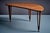 An elegant triangular teak coffee table by BC Møbler, Denmark, 1960s. This rare Scandinavian piece features an organically...