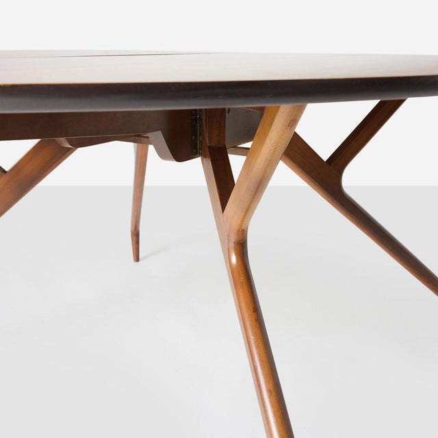 Edward Frank Dining Table USA, c.1960’s A drop leaf dining table with spider legs in walnut designed by Edward Frank for...