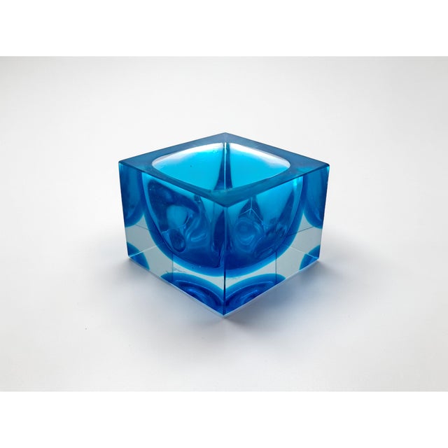 Murano glass ashtray made with the sommerso glass technique, which creates overlapping layers of color. The geometric and...